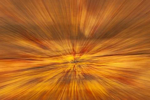 An abstract explosion of golden light in dynamic motion. Stock Photos