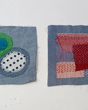 Abstract fabric composition with stitched geometric shapes.  Fotos Stock