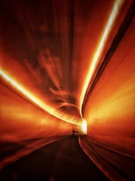 Abstract of fast moving drive through a mountain highway tunnel. Stock Photos