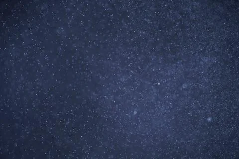 Abstract festive background with selective focus. Bright particles on dark back Stock-Illustration