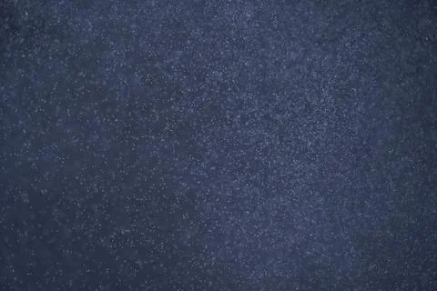 Abstract festive background with selective focus. Bright particles on dark back Stock-Illustration