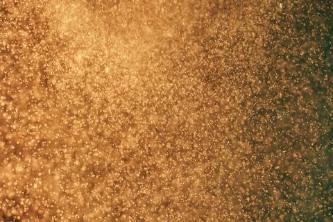 Abstract festive background with selective focus. Bright yellow particles, dark Stock Illustration