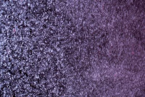 Abstract festive background with selective focus. Bright white particles on dark Illustrazione stock