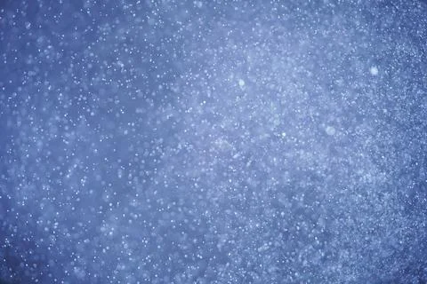 Abstract festive background with selective focus. Bright particles, snow, space Stock-Illustration