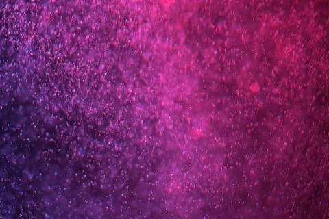 Abstract festive background with selective focus. Bright particles on dark red Stock-Illustration