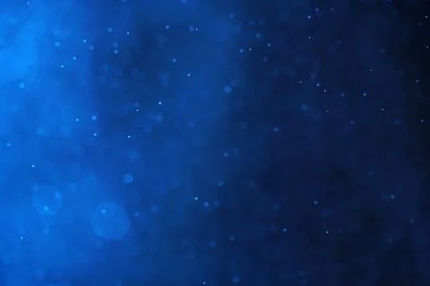 Abstract festive background with selective focus. Bright blue bokeh on black Stock-Illustration