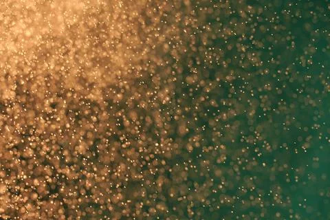 Abstract festive background with selective focus. Bright yellow particles, green Stock-Illustration