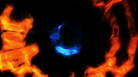 Abstract fiery orange ring encompassing a luminous blue form Stock Footage 299240748