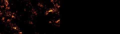 Abstract fiery particle motion with glowing orange embers flowing through d.. Stock Footage 340456789