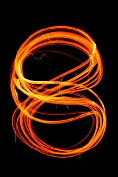 Abstract fiery pattern in the shape of the number 8. Drawing shapes with fire Stock Photos
