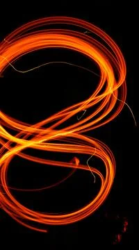 Abstract fiery pattern in the shape of the number 8. Drawing shapes with fire Stock Photos
