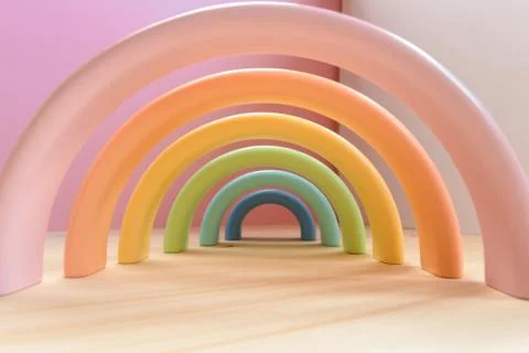 Abstract figures from elements of the children's designer wooden pastel rainbow Foto stock