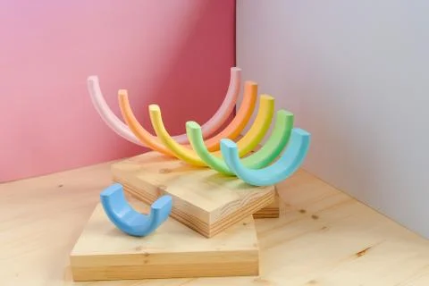 Abstract figures from elements of the children's designer wooden pastel rainbow Stock Photos
