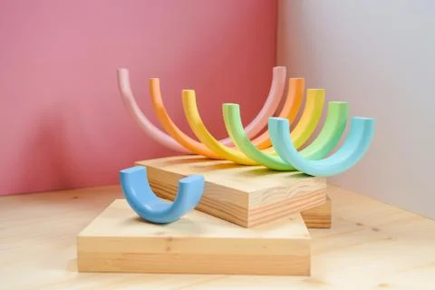 Abstract figures from elements of the children's designer wooden pastel rainbow Stock Photos