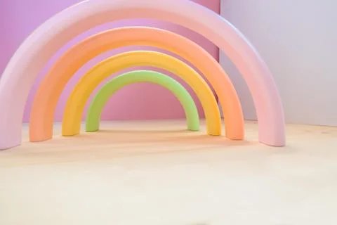 Abstract figures from elements of the children's designer wooden pastel rainbow Foto stock