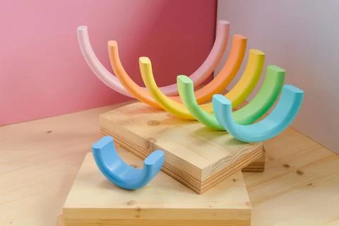 Abstract figures from elements of the children's designer wooden pastel rainbow Stock Photos