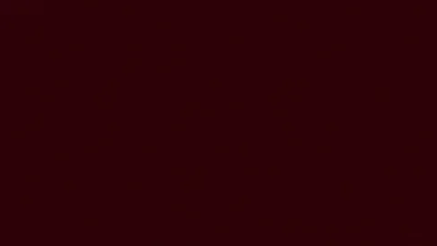 Abstract fire and flames on deep red backdrop - seamless looping backdround (4K) Stock Footage 127357758