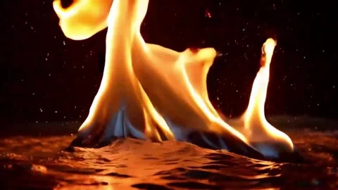 Abstract Fire Dance, Mesmerizing Flames Rising from Liquid Surface Stock Footage 302321025