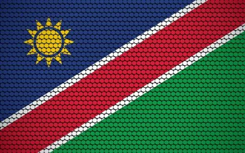 Abstract flag of Namibia made of circles. Namibian flag designed with colored 스톡 일러스트