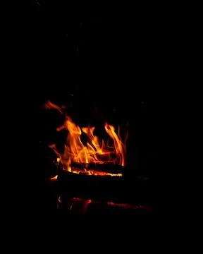 Abstract flame of fire from a campfire on a black background Foto stock