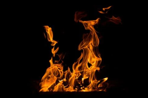 Abstract flame. Fire element on the black background. Stock Photos