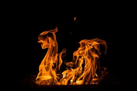 Abstract flame. Fire element on the black background. Stock Photos