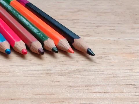 Abstract Flat Lay / Layout with Sharpened color pencils placed on a wood Stock Photos