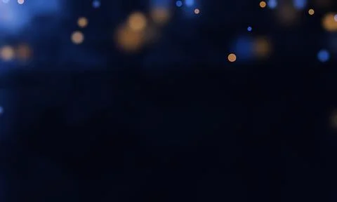 Abstract floating gold particles over dark blue smoke background for luxury.. Stock Photos