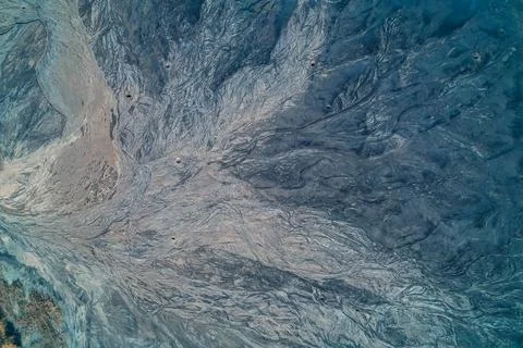 Abstract flow patterns of industrial waste. Aerial view of toxic tailings marked Foto stock