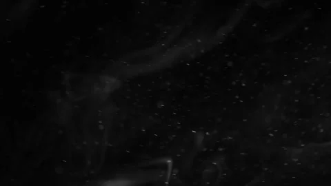 Abstract flowing ink in water creates mesmerizing patterns. Dark liquid swirls w Video stock 340456669