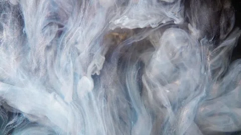 Abstract flowing liquid motion with vibrant swirls. Dynamic ink dispersion in wa 库存影片 340456620