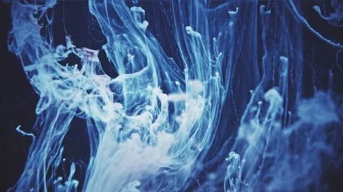 Abstract flowing smoke waves in vibrant blue tones. Dynamic particle motion with Видео 340456413