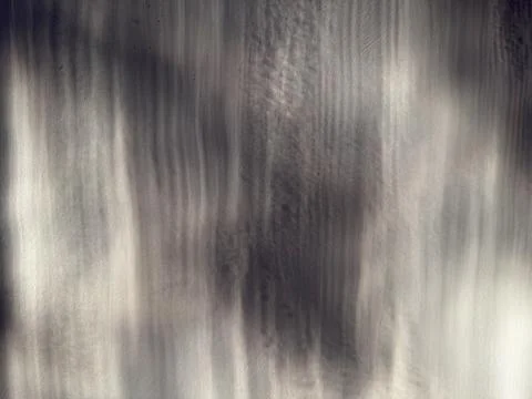 Abstract flowing vertical texture blurred motion serene monochrome landscape Foto stock