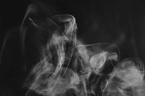 Abstract flowing white smoke patterns and wisps creating graceful curves ag.. Stock Photos