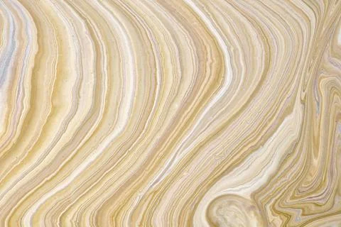 Abstract fluid art background light brown and beige colors. Liquid marble. Stock Photos