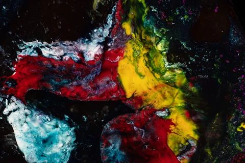 Abstract Fluid Art Texture with Red Yellow and Cyan Acrylic Paint Explosion Stock Photos