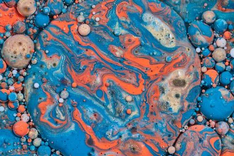Abstract flying disc with three dimensional bubbles of color in acrylic paint 写真素材