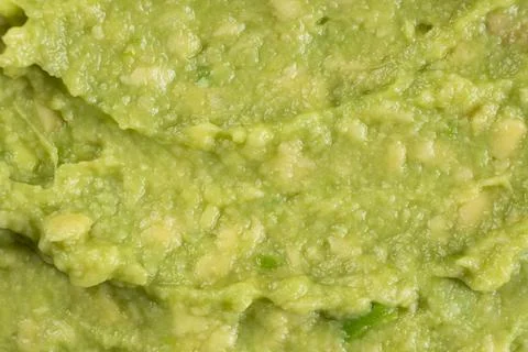 Abstract food background of fresh mashed avocado texture Stock Photos