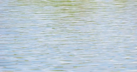 Abstract footage of sky and clouds reflecting on the surface of the lake 動画素材 237809850