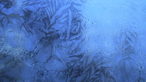 Abstract frosty pattern on glass, background texture on the window Stock Footage 212545790