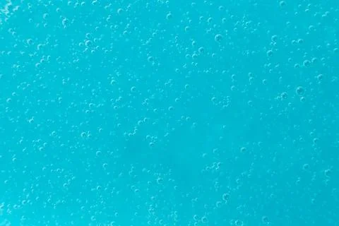 Abstract full frame background of blue liquid soap texture with micro bubbles Stock Photos