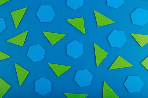 Abstract geometric background with green triangles and blue polygons on blue Stock Photos