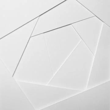 Abstract geometric background in light tones from sheets of thick white paper Stock Photos