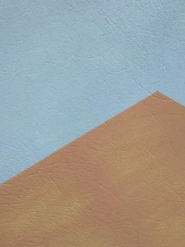 Abstract geometric background with textured light blue and tan surfaces Stock Photos
