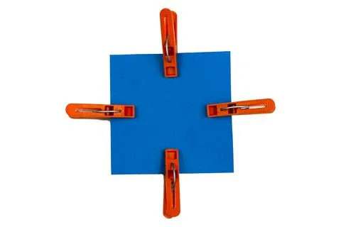 Abstract Geometric Composition of Brown Plastic Clothespins and Blue Square S Stock Photos