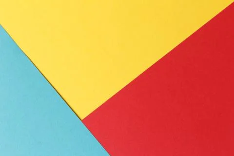 Abstract geometric festive background: red, yellow, blue. Paper background top Stock Photos