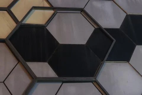 Abstract Geometric Hexagon Pattern Mosaic with Wood and Stone Textures Foto stock