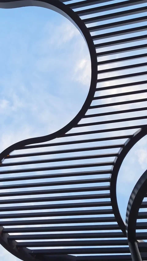 Abstract Geometric Metal Structure Against Blue Sky Stock Footage 336553247