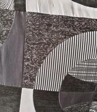Abstract geometric patchwork textile background with gray stripes and waves Stock Photos