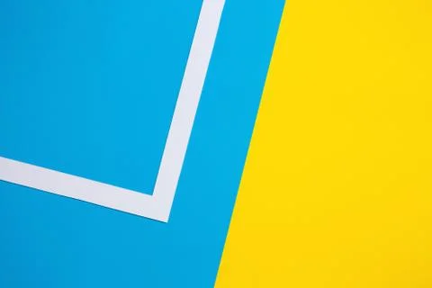 Abstract geometric pattern design: bright blue, yellow color paper flat lay Stock Photos